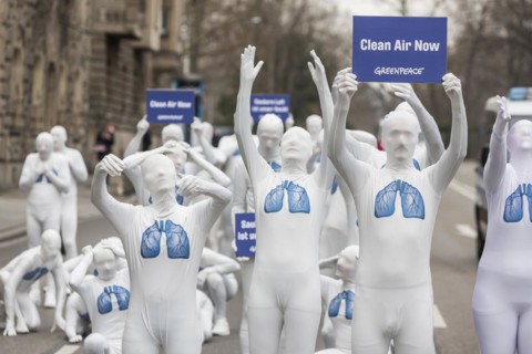 Protest of the environmental organisation Greenpeace, on the Bundesstrasse 14 40 activists demand better air quality, the Neckartor is considered the most polluted street in Germany with high levels o...
