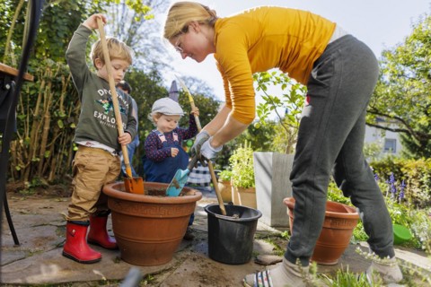 Children help with the gardening. Bonn, Germany, Europe