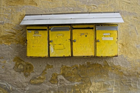 Old battered house letter boxes
