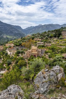 View of typical houses of the mountain village Fornalutx with mountain landscape