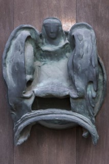 Left bronze fitting on the door of the Tugendbrunnenpotrtal