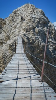 Tourist on the suspension bridge in Monte Cristallo