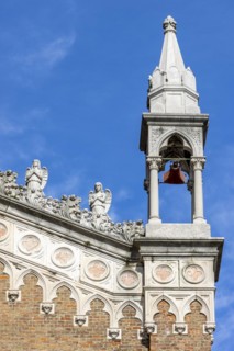 Detail of the Capuchin Church of Our Lady of Lourdes with a small tower and two small statues of angels