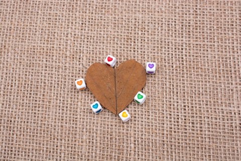 Colorful cubes with a heart on leaf on canvas