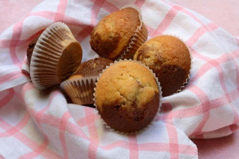 Chocolate muffins in kitchen towel