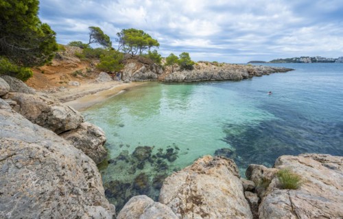 Small bay with sandy beach and blue sea