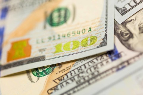 Abstraact of one hundred dollar bill laying on flat surface