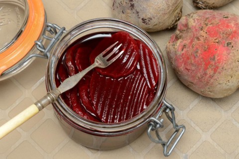 Pickled beetroot in glass jar and beetroot