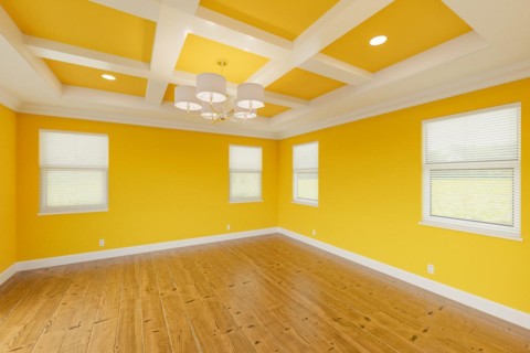 Beautiful bold yellow custom master bedroom complete with fresh paint