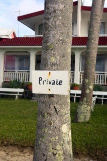 A sign saying Private was nailed to a tree trunk as a hint