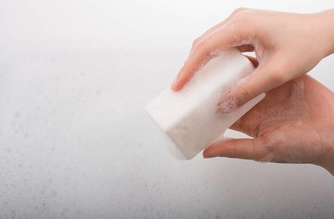 Hand washing and soap foam on a foamy background