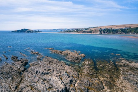 Aerial view of Burgh Island and Bigbury Beach from a drone