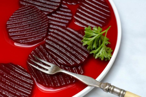 Sliced pickled beetroot on plate