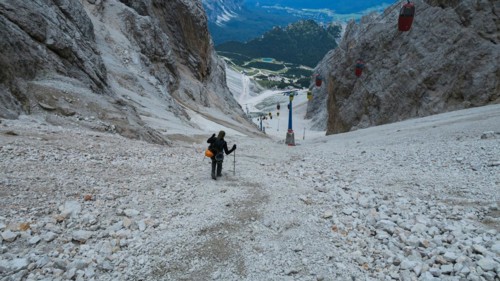 Tourist from the inventory trail in the gully with the gondola lift to Forcella Staunies