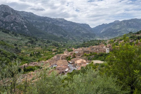 View over typical houses of the mountain village Fornalutx with mountain landscape
