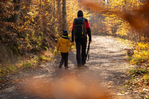 Mum and child are walking along the mountain hiking trail. Family spending time. Polish mountains