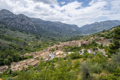 View over typical houses of the mountain village Fornalutx with mountain landscape