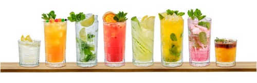 Set of multicolored summer refreshing soft drinks on white background