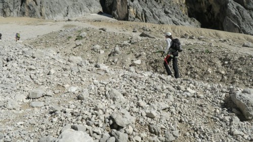 Tourist with equipment on a mountain trail in the Alps. Zugspitze massif