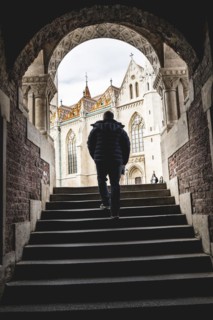 A man arriving at the Fishermans Bastion at the heart of Budas Castle District in Budapest