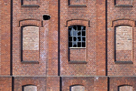 Destroyed window on an old factory building
