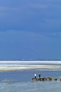 View over the frozen Jade Bay towards Wilhelmshaven