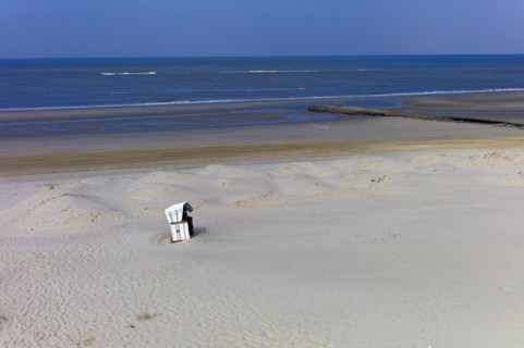 Lonely beach chair on the beach of the island of Wangerooge