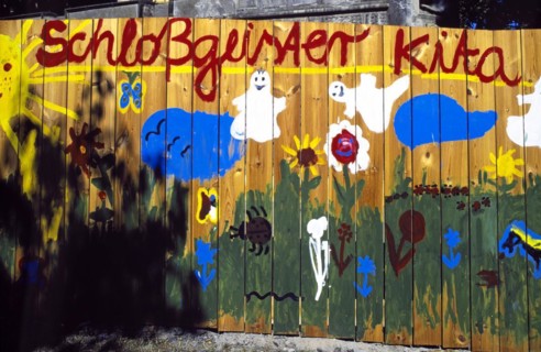 Graffiti on a board wall