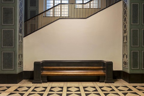 Wooden bench in retro style in the vestibule of Spandau Town Hall