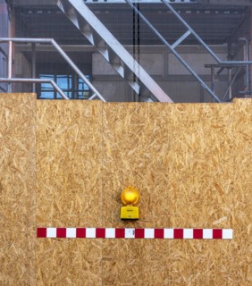 Building fence made of chipboard