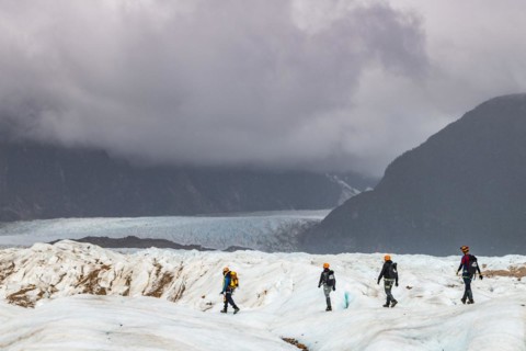 Hikers on the Exploradores glacier in the San Valentin massif
