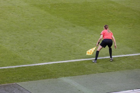 Lineswoman on the sidelines of a football match