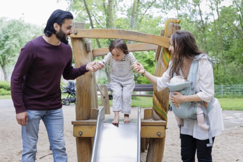 Family with children on a playground