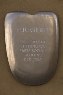 Information sign on a house wall of the Jakob Fugger Settlement