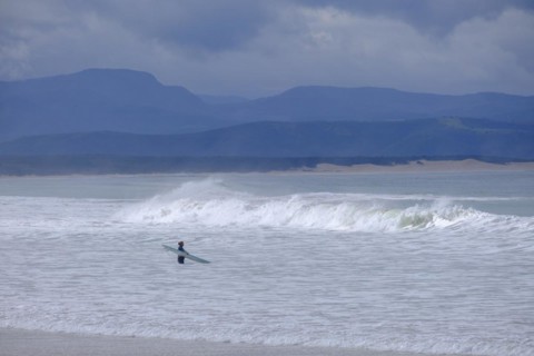Waves on the beach with dark sky