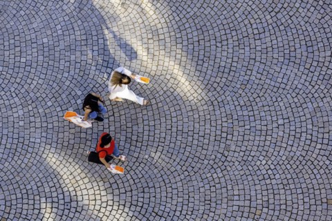 Three people from a birds eye view