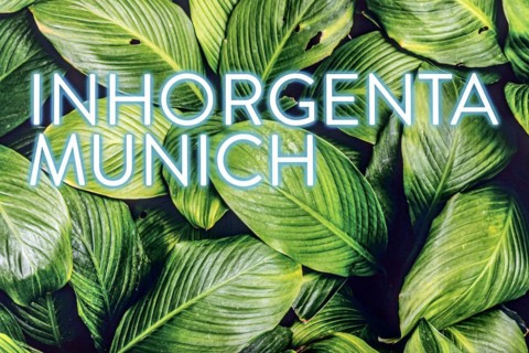 Inhorgenta Munich lettering on LED illuminated display with tropical leaves