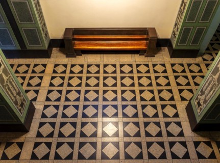 Wooden bench in retro style in the vestibule of Spandau Town Hall