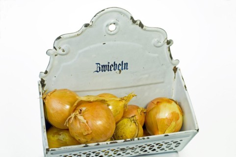 Onions in a metal onion box