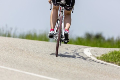 Cyclist with racing bike in the idyllic Lautertal