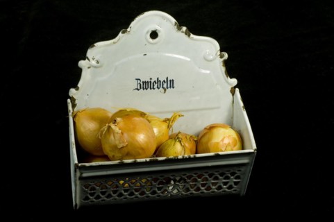 Onions in a metal onion box