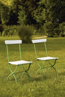 Two garden chairs on a lawn