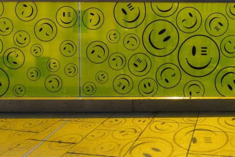 Yellow plastic wall with smileys