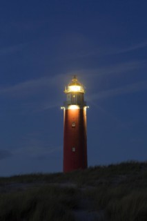 Eierland Lighthouse in the dunes at sunset on the northernmost tip of the Dutch island of Texel