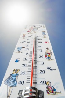Worm's-eye view of thermometer measures extremely hot temperature of 40 degrees Celsius