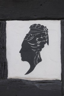 Woman's hairstyle at the half-timbered house of the hairdresser's salon