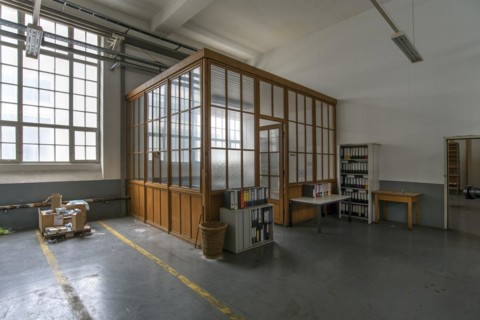 Office compartment with folders left behind in a former paper factory