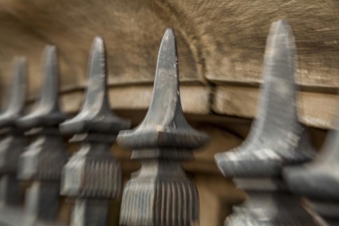 Iron fence in front of a building