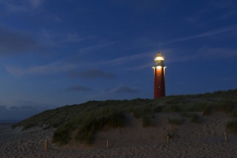 Eierland Lighthouse in the dunes at sunset on the northernmost tip of the Dutch island of Texel