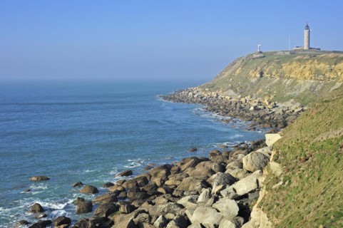 Lighthouse and sandstone boulders from cliff on beach at Cap Gris Nez